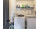 Convenient laundry room with washer, dryer, and shelving at 2211 Bittle Way, St Cloud, FL 34769