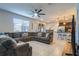 Open concept living area with sectional sofa and kitchen views at 2211 Bittle Way, St Cloud, FL 34769