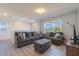 Relaxing living room with cozy seating and plentiful natural light at 2211 Bittle Way, St Cloud, FL 34769