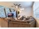 Open concept living room featuring sectional sofa and accent chair at 2211 Bittle Way, St Cloud, FL 34769