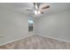 Well-lit bedroom, ceiling fan, carpet, and a window at 2318 Andrews Valley Dr, Kissimmee, FL 34758