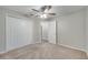 Bedroom with ceiling fan, carpet, and double door closet at 2318 Andrews Valley Dr, Kissimmee, FL 34758