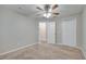 Spacious bedroom featuring ceiling fan, carpet, and ample closet space at 2318 Andrews Valley Dr, Kissimmee, FL 34758