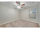 Bright bedroom with ceiling fan, carpet, and window with blinds at 2318 Andrews Valley Dr, Kissimmee, FL 34758