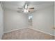 Bright bedroom with ceiling fan, carpet, and window at 2318 Andrews Valley Dr, Kissimmee, FL 34758