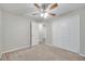 Spacious bedroom with ceiling fan, carpet, and closet at 2318 Andrews Valley Dr, Kissimmee, FL 34758