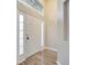 Front entry with white door and wood-look floors at 2318 Andrews Valley Dr, Kissimmee, FL 34758