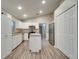 Kitchen with island, stainless steel appliances, and white cabinets at 2318 Andrews Valley Dr, Kissimmee, FL 34758