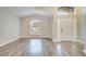 Bright living room with wood-look floors and large windows at 2318 Andrews Valley Dr, Kissimmee, FL 34758