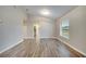 Living room with wood-look floors and window at 2318 Andrews Valley Dr, Kissimmee, FL 34758
