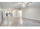 Open living room featuring wood-look flooring and ceiling fan at 2318 Andrews Valley Dr, Kissimmee, FL 34758