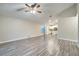Spacious living room with wood-look flooring and access to kitchen at 2318 Andrews Valley Dr, Kissimmee, FL 34758