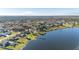 Aerial view showcasing lakefront home and community at 241 Lake Thomas Dr, Winter Haven, FL 33880