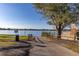 Lake access with a paved boat ramp and wooden fence at 241 Lake Thomas Dr, Winter Haven, FL 33880