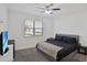 Bedroom with a ceiling fan and window at 2587 Summer Star Way, Leesburg, FL 34748