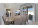 Dining area leading to an open-concept layout with a kitchen and living room at 2587 Summer Star Way, Leesburg, FL 34748