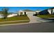 Charming single-story home with a well-maintained lawn, tidy landscaping, and an attached two-car garage at 2587 Summer Star Way, Leesburg, FL 34748