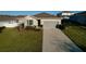 Charming single-story home featuring a two-car garage and a well-maintained front lawn at 2587 Summer Star Way, Leesburg, FL 34748