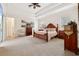 Large main bedroom with tray ceilings and an ensuite bathroom at 2704 Swoop Cir, Kissimmee, FL 34741