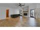 Living room featuring a fireplace and dark green couch at 3251 Pinewood Ct, Kissimmee, FL 34746