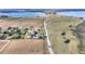 Aerial view of home near lake and roadway at 3610 Old Berkley Rd, Auburndale, FL 33823