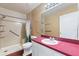 Bathroom with walk-in shower and updated vanity at 3610 Old Berkley Rd, Auburndale, FL 33823
