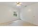 Bright bedroom with ceiling fan and window at 3610 Old Berkley Rd, Auburndale, FL 33823
