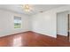 Bedroom with hardwood floors and ceiling fan at 3610 Old Berkley Rd, Auburndale, FL 33823