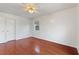Bedroom with hardwood floors and ceiling fan at 3610 Old Berkley Rd, Auburndale, FL 33823