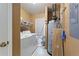 Laundry room with washer, dryer, and storage at 3610 Old Berkley Rd, Auburndale, FL 33823