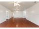 Open living room showcasing wood floors and views into adjacent rooms at 3610 Old Berkley Rd, Auburndale, FL 33823