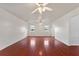 Spacious living room with wood flooring and ceiling fan at 3610 Old Berkley Rd, Auburndale, FL 33823