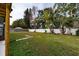 Spacious backyard with a well-maintained lawn and a privacy fence, perfect for outdoor activities at 3618 Willow Lake Ct, St Cloud, FL 34769