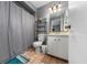 Bathroom with shower/tub, vanity, and linen storage at 3618 Willow Lake Ct, St Cloud, FL 34769