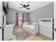 Cozy bedroom with a daybed, dresser, and window at 3618 Willow Lake Ct, St Cloud, FL 34769