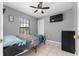 Bedroom with a bed, dresser and window at 3618 Willow Lake Ct, St Cloud, FL 34769