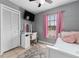 Bedroom featuring a white dresser and full-size bed at 3618 Willow Lake Ct, St Cloud, FL 34769