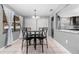 Kitchen dining area with granite table and four chairs at 3618 Willow Lake Ct, St Cloud, FL 34769