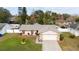 One-story house with a pink garage door and nicely landscaped yard at 3618 Willow Lake Ct, St Cloud, FL 34769