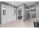 Bright foyer featuring tile flooring, a front door with glass inserts, and views into the rest of the house at 3618 Willow Lake Ct, St Cloud, FL 34769
