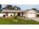 Charming single Gathering home with well-maintained lawn and attractive stone accents on the attached garage at 3618 Willow Lake Ct, St Cloud, FL 34769