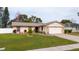 Charming single Gathering home with well-maintained lawn and attractive stone accents on the attached garage at 3618 Willow Lake Ct, St Cloud, FL 34769
