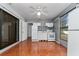 Small galley kitchen with white appliances and mosaic backsplash at 3618 Willow Lake Ct, St Cloud, FL 34769