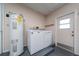 Laundry room with washer, dryer and hot water heater at 3618 Willow Lake Ct, St Cloud, FL 34769