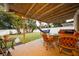 Covered patio area with outdoor seating and a hammock, ideal for enjoying the backyard at 3618 Willow Lake Ct, St Cloud, FL 34769