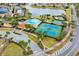 Community pool, tennis courts, playground, and lake at 4364 Fox Glen Loop, Kissimmee, FL 34746
