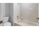 Clean bathroom with a tub and shower combination at 4364 Fox Glen Loop, Kissimmee, FL 34746