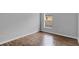 Bedroom featuring wood-look flooring and a window at 4364 Fox Glen Loop, Kissimmee, FL 34746