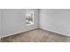 Bedroom with window and neutral colored walls at 4364 Fox Glen Loop, Kissimmee, FL 34746