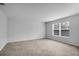 Bright bedroom with large window and neutral decor at 4364 Fox Glen Loop, Kissimmee, FL 34746
